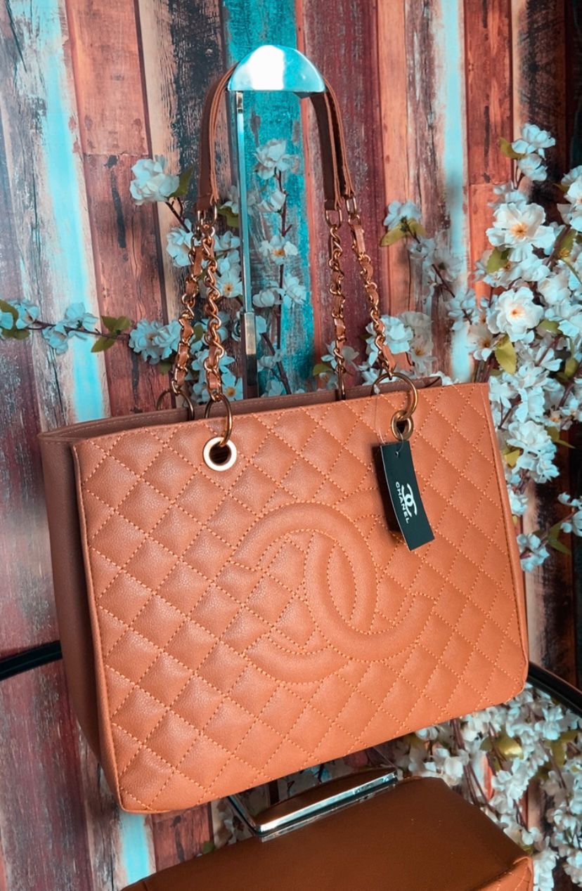 Bolsa Chanel Shoper corrente metal dourado